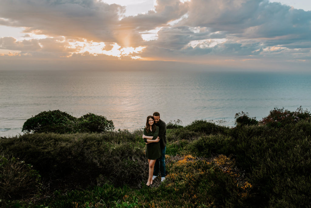 Couple holding each other at Torrey Pines