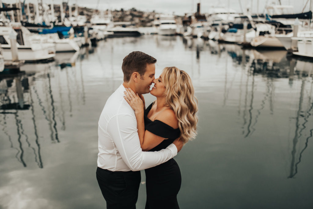 couple kissing on the docks