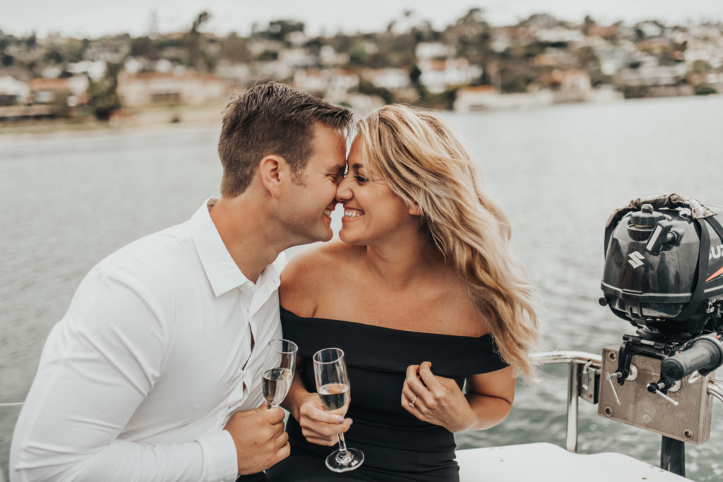 couple having champagne on boat